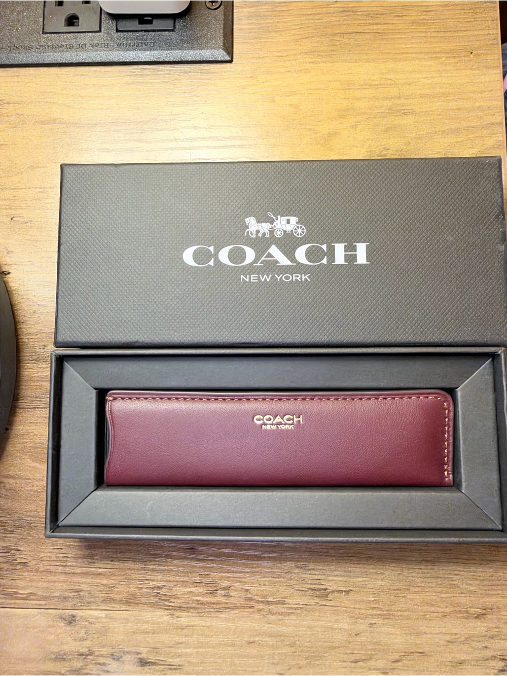 Coach comb with sleeve